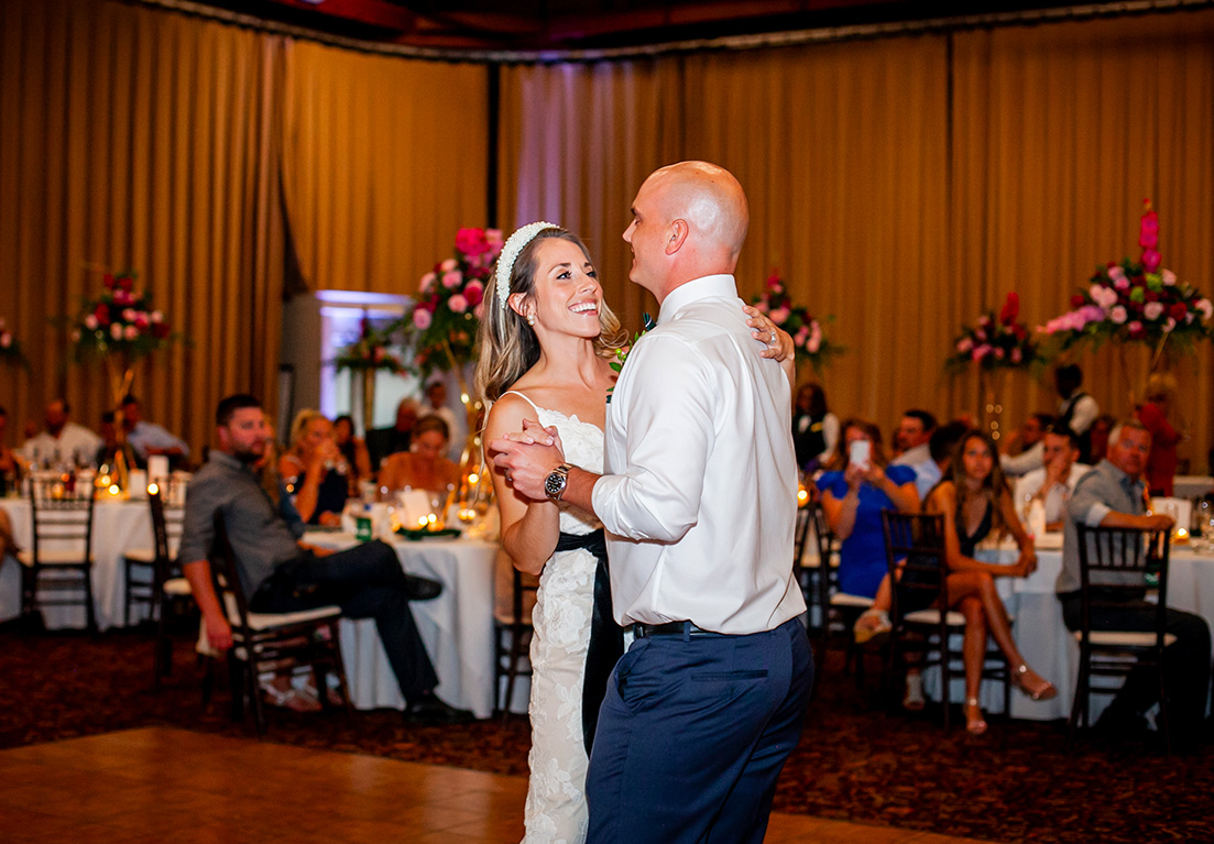 bride and groom dancing in the middle of the room