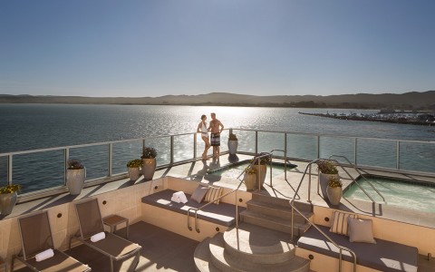couple standig by spa pool