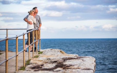 Couple looking out onto the ocean 