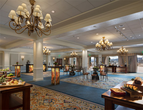 large room with cocktail tables and appetizer tables