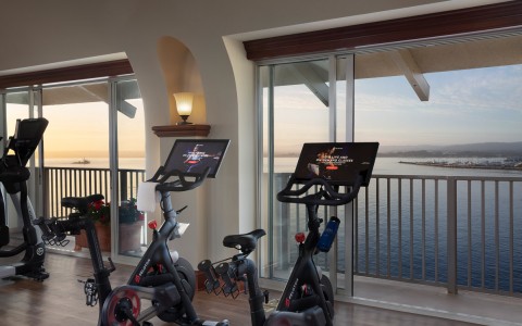 fitness center with peloton bikes overlooking ocean gallery 16