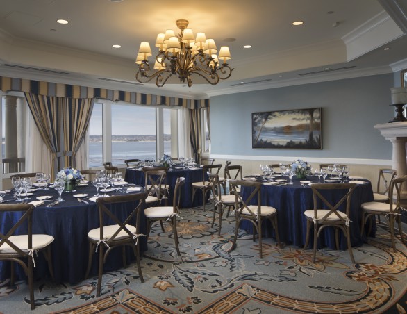 ocean club room set with round tables for a meeting