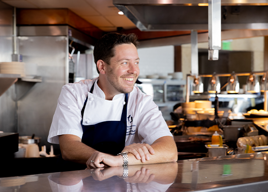 Executive Chef Michael Rotondo smiling in the kitchen