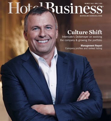 Man wearing blue suit on the cover of Hotel Business magazine