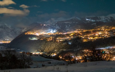 view from the slopes of the town below at night