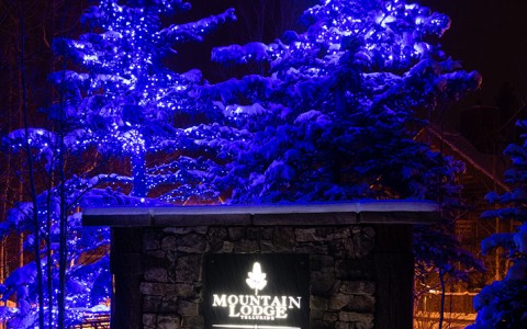 the mountain lodge and the view sign at night