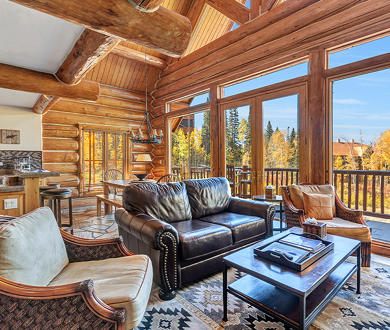 a large log cabin with lots of natural light 