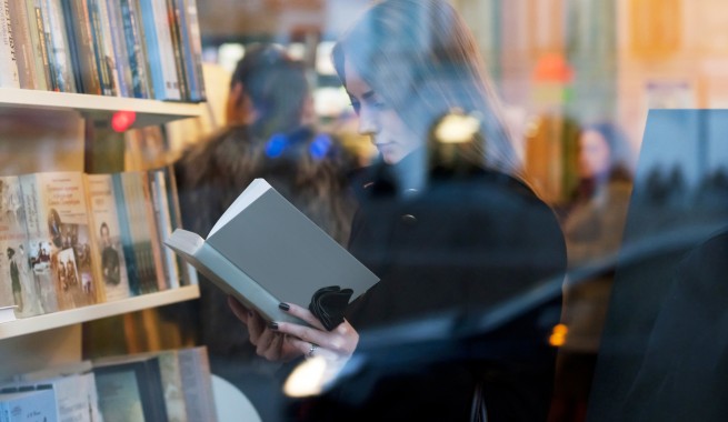 women reading a book in book store