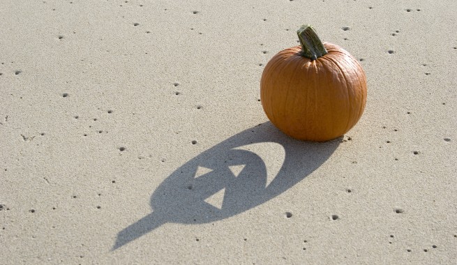 Plain pumpkin with a jack'o lantern shadow