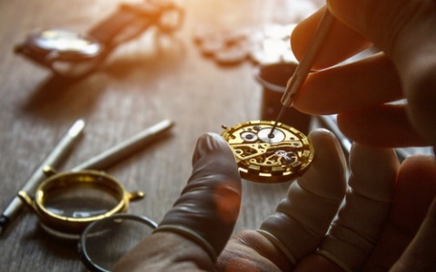 watchmaker repairing a watch