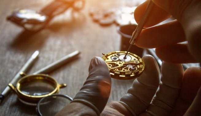 watchmaker repairing a watch