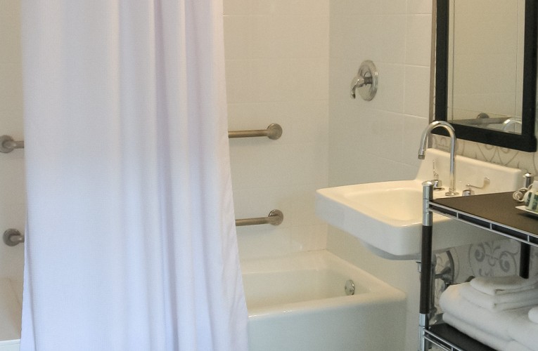 hotel bathroom with sink and shower