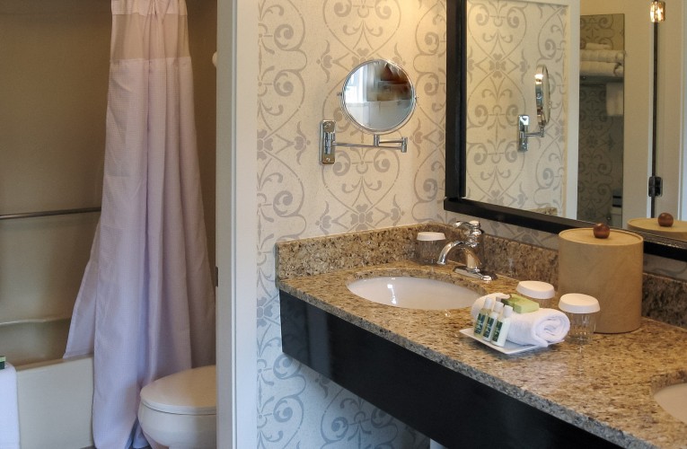 bathroom vanity next to shower