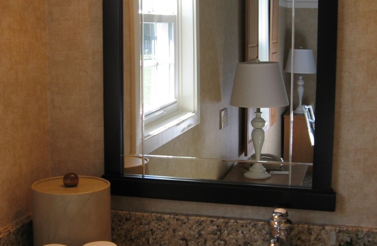 Vanity with reflection of hotel room