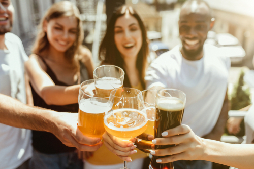 friends smiling and drinking beer
