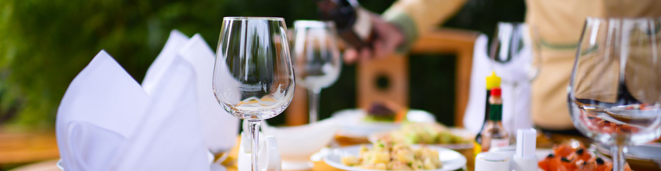 detail shot of table set with wine glasses