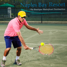 a male playing tennis on the court