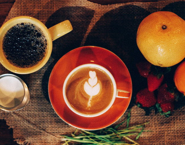 overhead view of a cup of coffee and latte