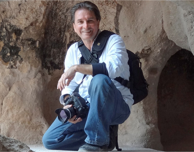 photographer posing with camera