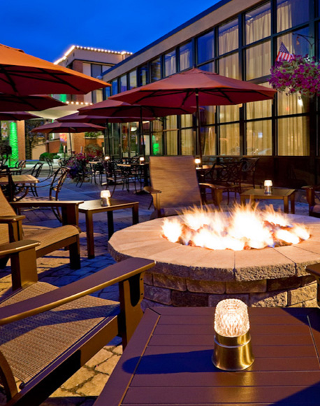 outdoor fireplaces with seating chairs and umbrellas 