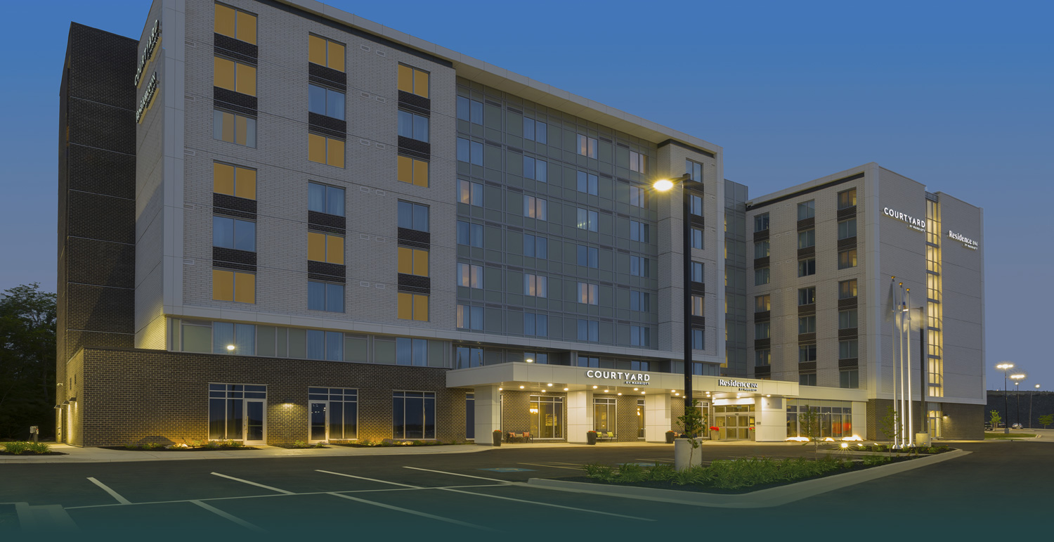 outside of hotel building and parking lot