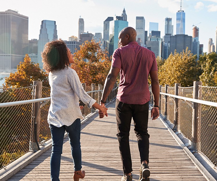 couple walking on a bridge