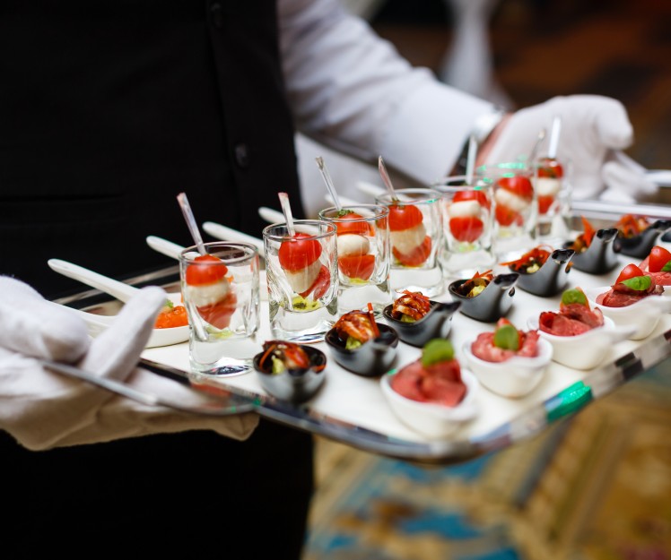 waiter holding a catering platter