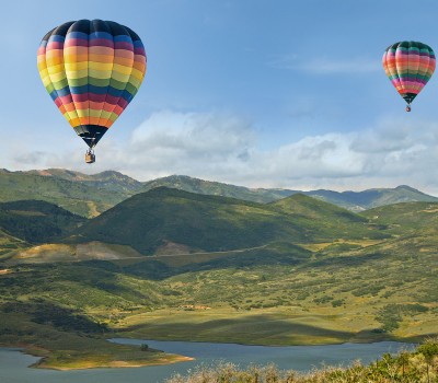 two colorful hot air balloons in the sky 