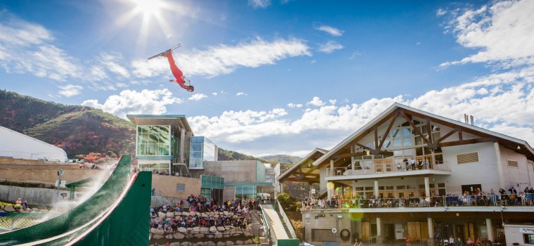 man skiing off a ramp in Utah Olympic Park