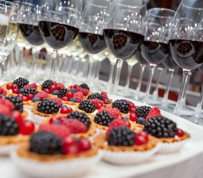 small desserts and glasses of wine