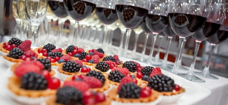 small desserts and glasses of wine