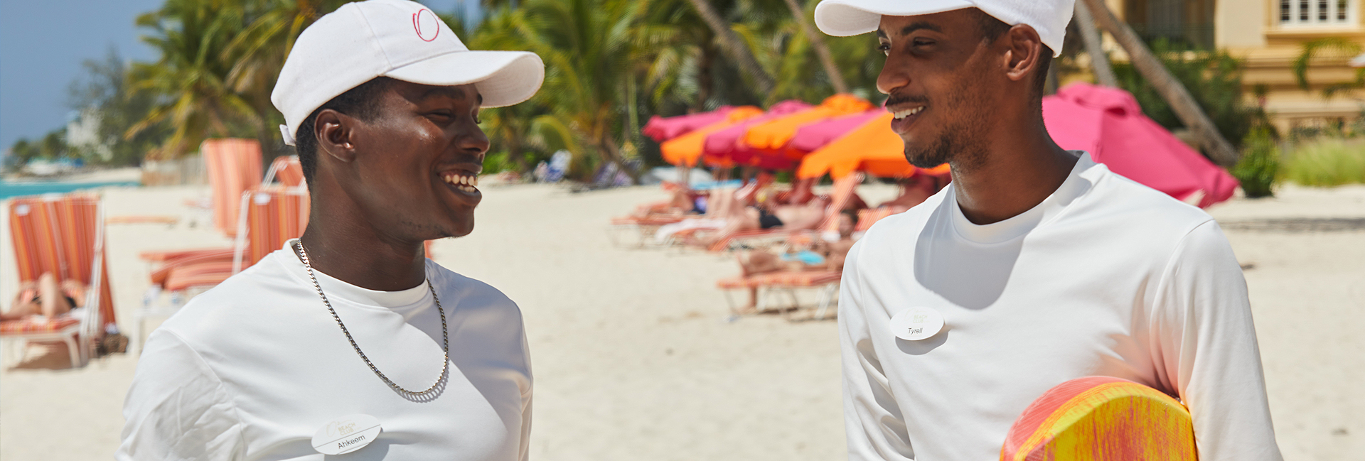 O2 workers talking on the beach