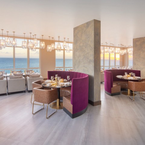restaurant setting with some purple booths