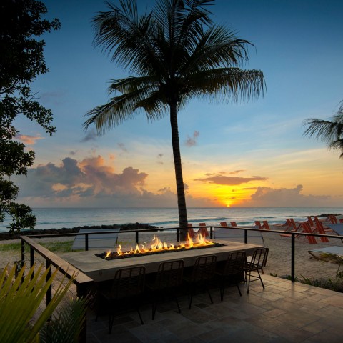 fire pit overlooking beach and sunset