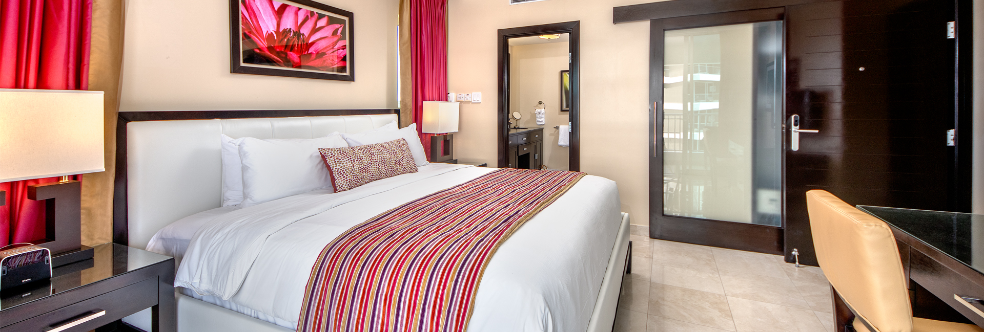 side shot of bed with flower photo above it