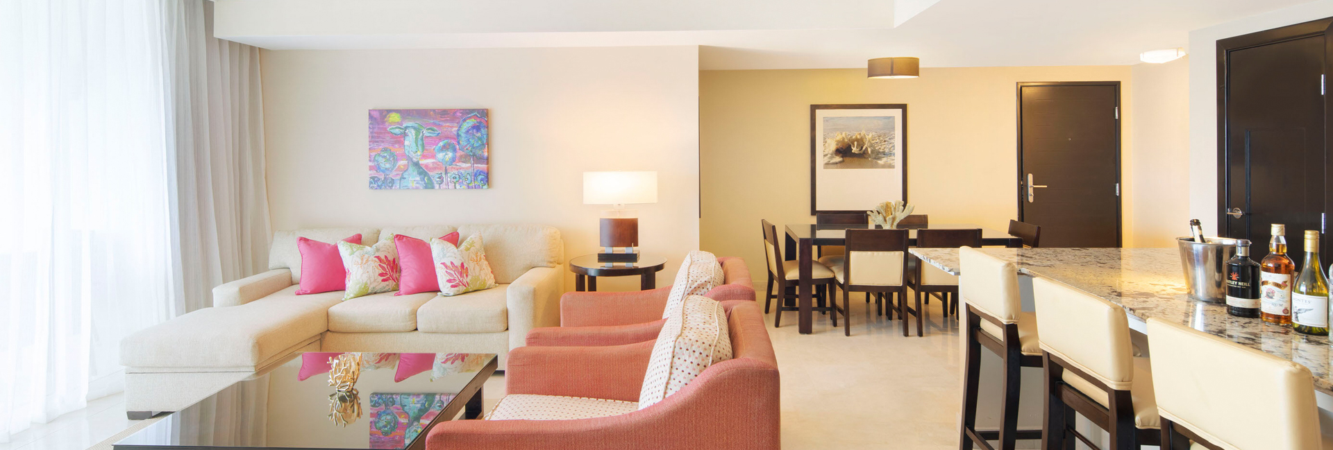 island area in suite with dining table and living room area