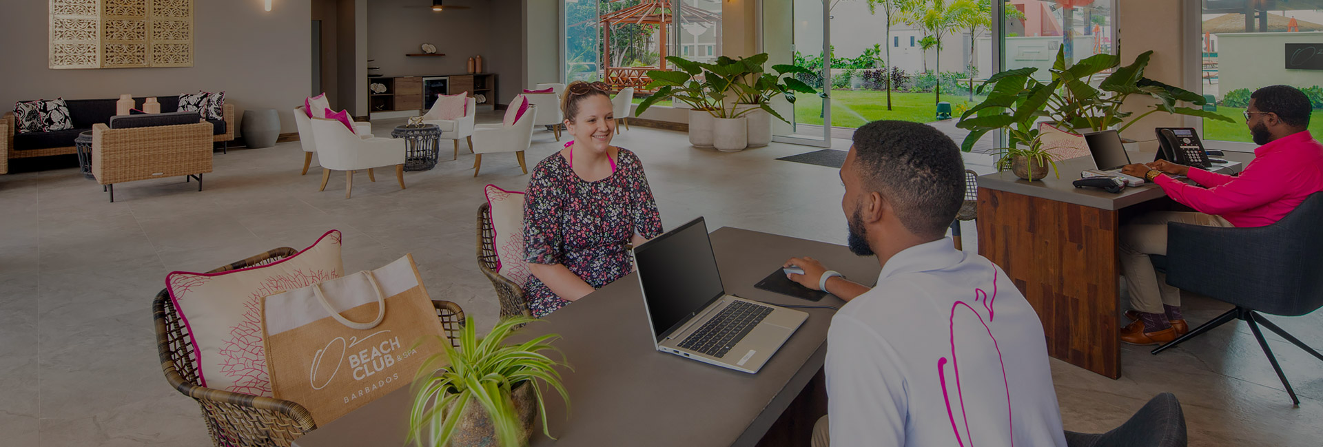 receptionist helping out customer at desk