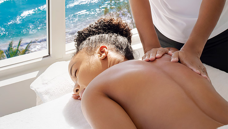 woman on her stomach getting massage