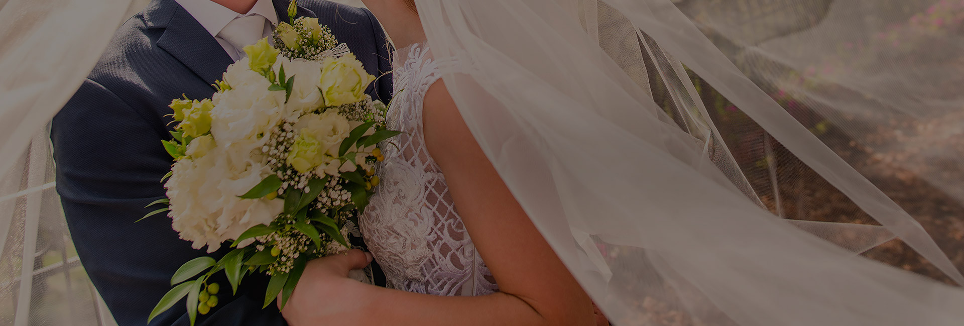 body shot of bride, groom, and bouquet