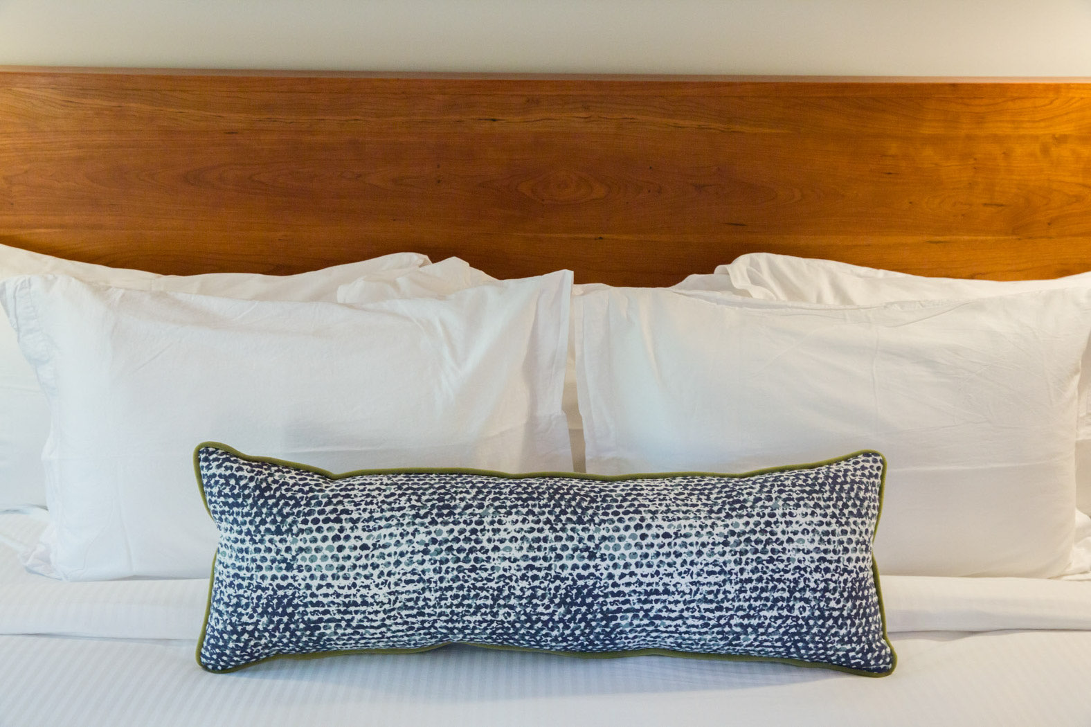 close up of pillows on bed 