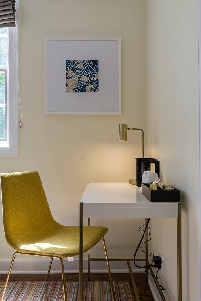 white desk with yellow chair 