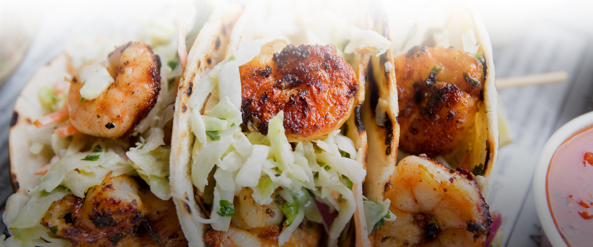 Succulent looking blackened shrimp taco with cabbage
