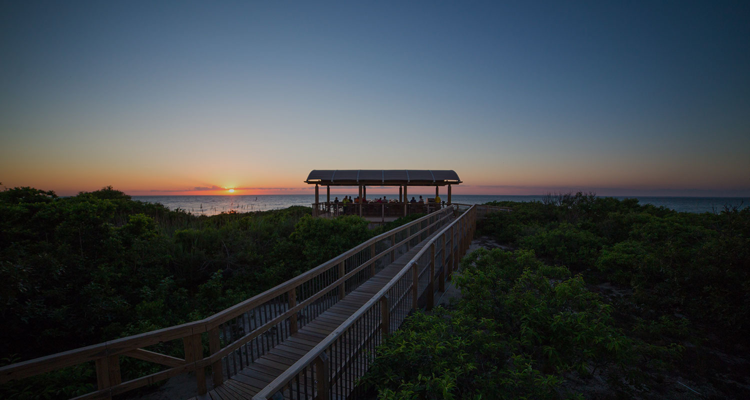 dock leading to the ocean