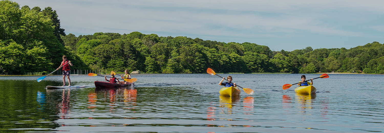 two people kayaking on a lake