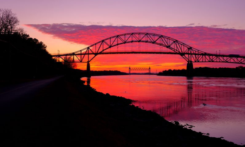 photo of beautiful pink and orange sunset over the cape cod bridge