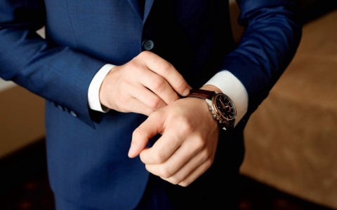 man putting on a watch