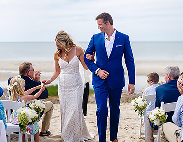 bride and groom walking down aisle