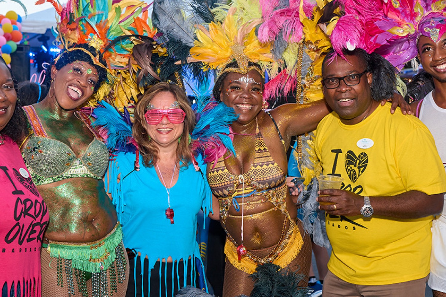 Festival dancers posing for a picture with guests