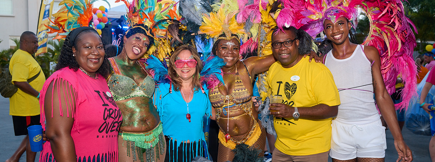 Festival dancers posing for a picture with guests
