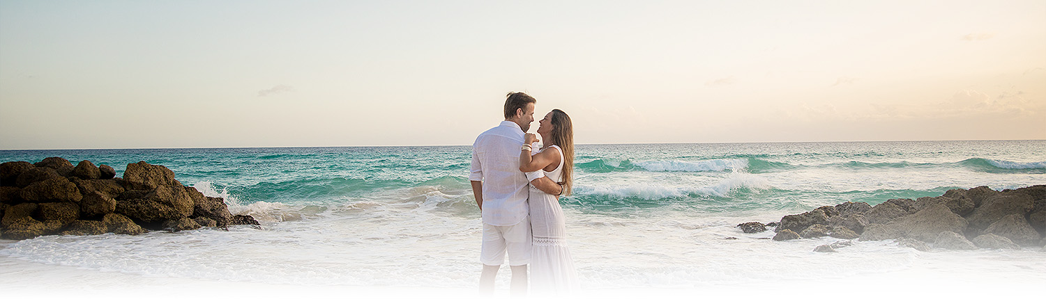 couple posing by the water